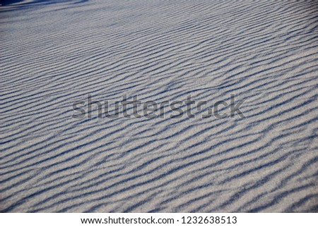 Closeup photo of sand wave pattern in a desert. Ground wave photo