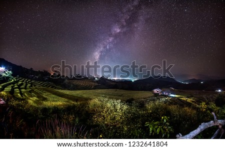 The Milky Way galaxy on the rice field on the mountain.Long exposure photograph, with grain.Image contain certain grain or noise and soft focus.
