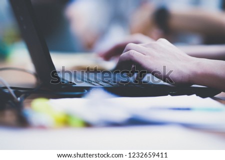 Hand typing computer notebook to working