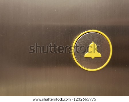 Alarm bell icon in elevator wall