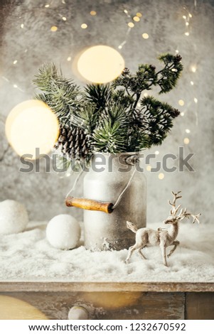 Vintage Christmas festive decoration, Snow-covered Christmas tree Branches,balls and reindeer.