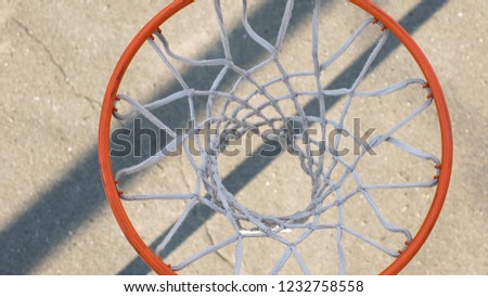 Basketball hoop against the ground, close-up of sports equipment details