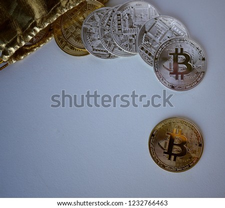 Golden bitcoins and silver bitcoins on white background. Cryptocurrency is a new financial business model now a day.