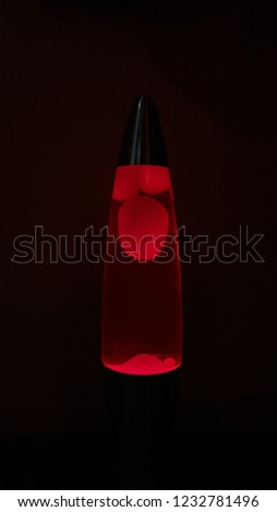 background and texture of burgundy and red circles and the shape of different shapes on a black background. lamp.