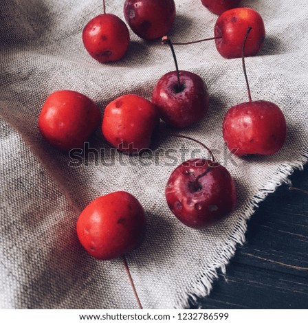 Little red apples on linen tableclothes