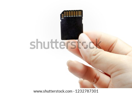 Woman hand holding a memory card isolated on a white background, File contains with clipping path.
