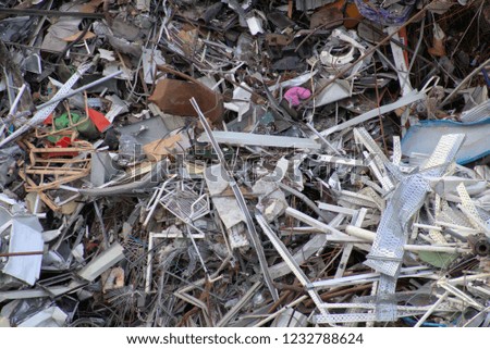 Scrap metal waste is stored in a recycling yard 