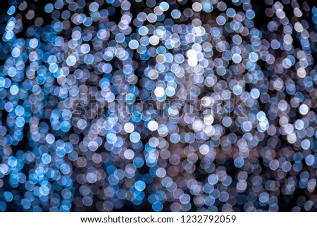 Abstract blue bokeh texture on black background