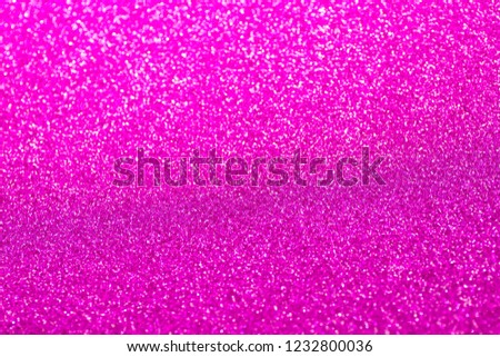 Blurred blaze pink glitter christmas texture backdrop. 
Red purple  photo of bokeh light background.
Abstract color rose gradient shiny Xmas lights happy new year for copy space.
top view.