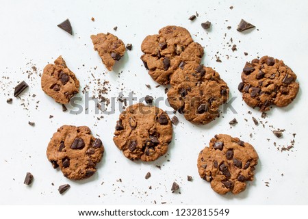 Baked Christmas cookies. Homemade Chocolate Chip Cookies on a light stone table. Top view flat lay background. Royalty-Free Stock Photo #1232815549