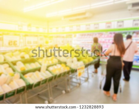 picture of blurred people in super market walking for shopping