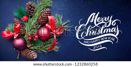 Merry Christmas and Happy New Year Hand lettering inscription with Branches of Christmas tree on dark blue shiny background. 