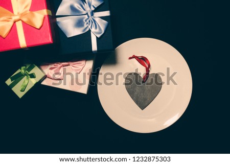 Black Friday concept photo. Present boxes for Birthday parties. Sale and discount. Christmas shopping ideas. Special offer. Wooden heart for valentine's day.
