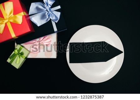 Black Friday concept photo with an arrow. Present boxes for Birthday parties. Sale and discount. Shopping ideas. Special offer. Copy space place.