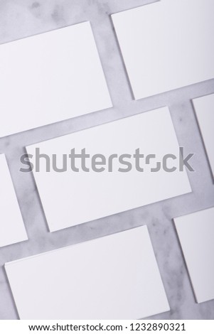 Mockup of white business cards stacks in a row on marble background, Ideals for presentation and design artwork