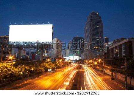 Blank billboard for advertisement at night time with street light. with copy space for your text message or content