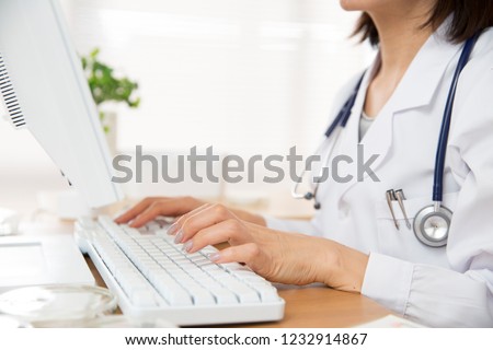 Japanese female doctor heading for PC