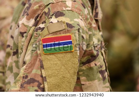 The Gambia flag on soldiers arm. The Gambia troops (collage)