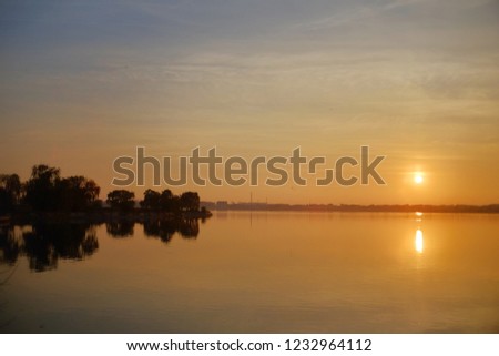 A beautiful sunset over a lake.