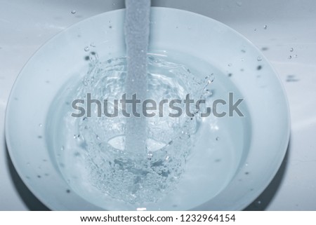 Splashing water in plate