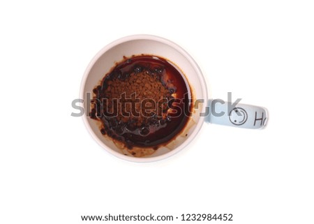 Isolated photo. A beautiful cup of instant coffee, on a white background. The process of making coffee. View from above.