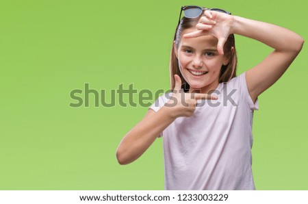 Young beautiful girl wearing sunglasses over isolated background smiling making frame with hands and fingers with happy face. Creativity and photography concept.