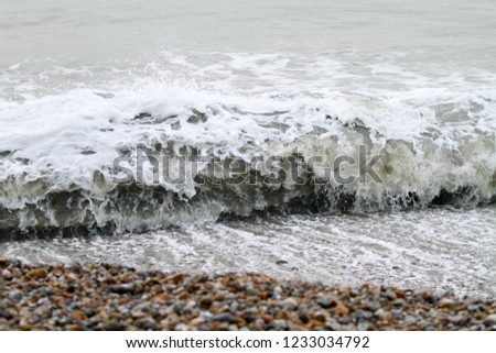 winter waves crashing into a sea