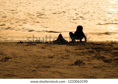 silhouette of people at the beach,Relaxing on the drip day.