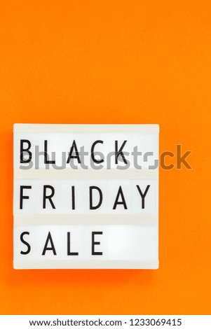 Creative Top view flat lay promotion composition Black friday sale text on white lightbox orange background copy space Template Black friday sale mockup fall thanksgiving promotion advertising