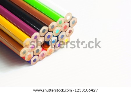 back to school border of multicolored pencils isolated on white backgroundSelective focus.
