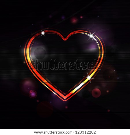 glowing valentine heart on a black background with lens flares