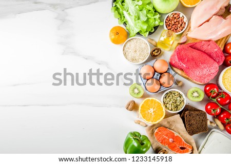 Healthy diet food. Various low fodmap ingredients selection - meat, vegetables, berry, fruit, grains, Trendy healthy lifestyle concept. On white marble background copy space top view