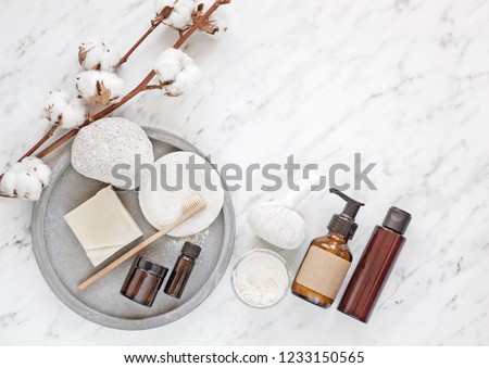 Zero waste natural cosmetics products on marble desk. Flat lay photo