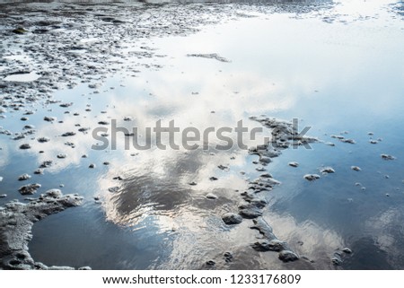 photo of the water reflection. sky and clouds.