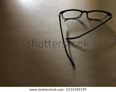 Eye glasses and the shadow