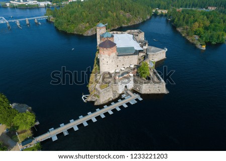 A view from the height of the medieval fortress of Olavinlinna on a sunny July day. Savonlina, Finland