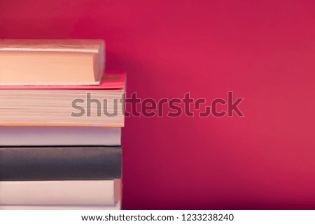 Stack of colorful books and free copy space