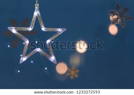 White electric light star with blue background.