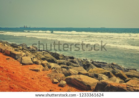Matte background. Wonderful seascape. Old photo. Rocky coastline. Waves breaking on a seashore. Marine background. Stunning vintage. Nostalgia. 