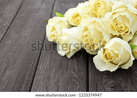 Roses against wooden background