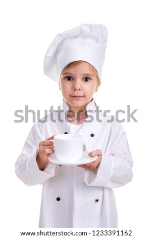 Happy girl chef white uniform isolated on white background. Holding the white cup with a saucer. Portrait image