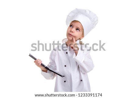 Girl chef white uniform isolated on white background. Holding the black ipad screen with one hand, and pointing finger on the cheek, thinking and looking up. Landscape image