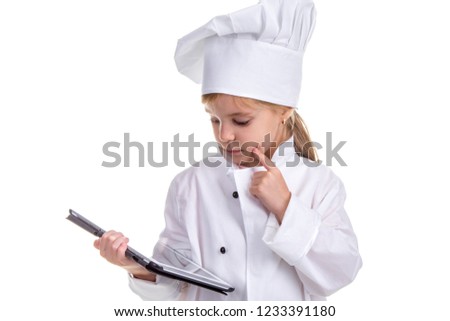 Girl chef white uniform isolated on white background. Holding the black ipad screen, thinking and looking on it. Landscape image