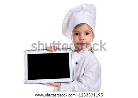 Girl chef white uniform isolated on white background. Showing the empty black ipad screen, looking at the camera. Landscape image