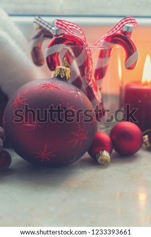 Christmas scene with decorations on winter windowsill close up, retro toned