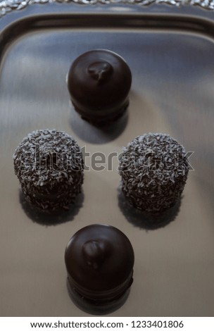 foam kisses, coconut ball, chocolate marshmallow, small chocolate-covered cream cake