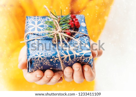 Child holds a Christmas decor and gifts on a white background. Selective focus. happy.