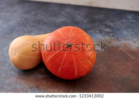 pumpkins on dark wooden background
