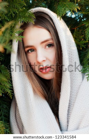 Spring outdoor portrait of young attractive woman