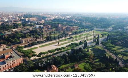 Aerial drone photo of iconic Circus Maximus site of an ancient Roman chariot racing stadium and mass entertainment venue next to famous Colosseum, Rome, Italy Royalty-Free Stock Photo #1233439597